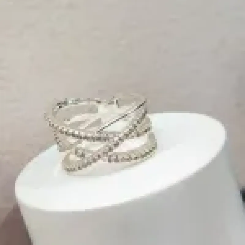 ANEL PRATA ENTRELAÇADO ZIRC