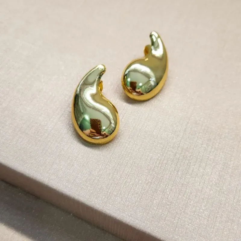 BRINCO OURO VIRGULA