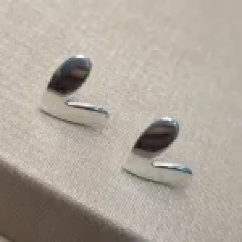 BRINCO PRATA CORAÇÃO TORTO