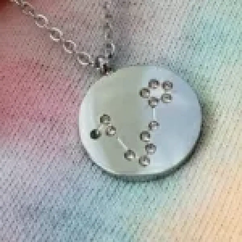 COLAR AÇO PEIXES