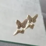 BRINCO OURO BORBOLETA CRAV	