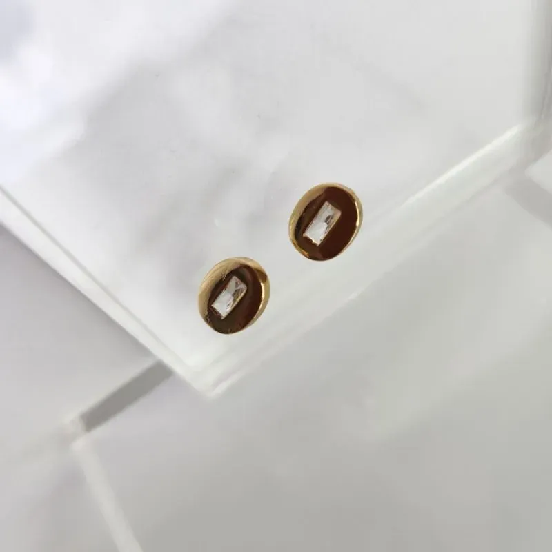 BRINCO OURO OVAL CRISTAL RETANG