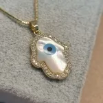 COLAR OURO OLHO MADREP MÃO	