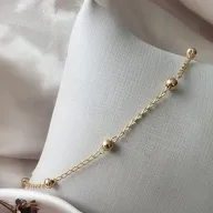 PULSEIRA OURO BOLINHA ESPASSADAS